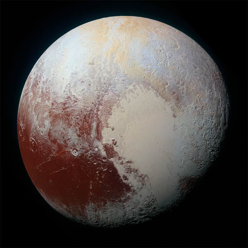 写真：冥王星の表面は赤茶けた地質と氷に覆われている