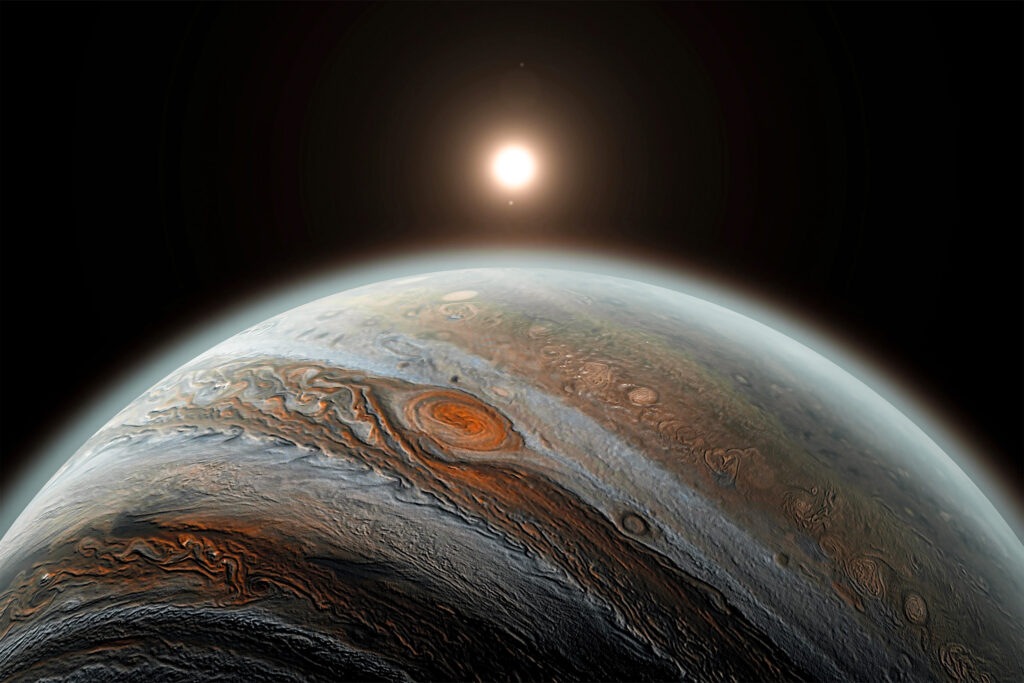 写真：宇宙空間の中で、人工衛星から木星を臨む様子。その先には遠く太陽が輝いている